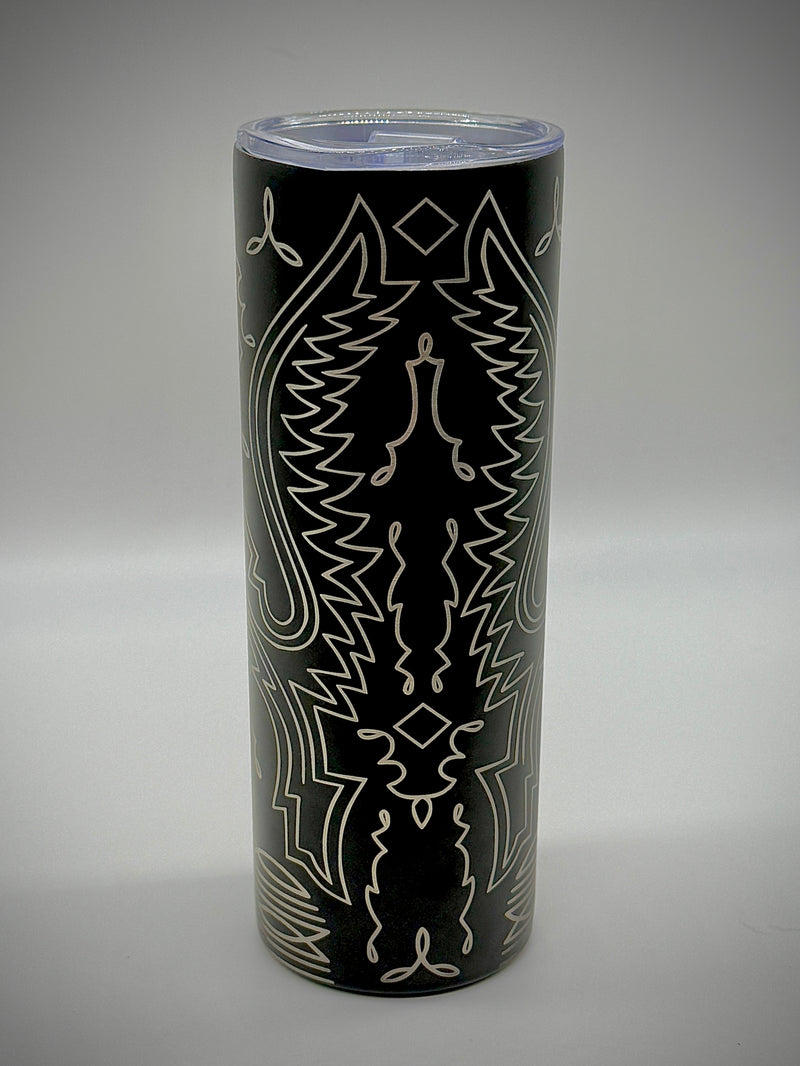 Black cylindrical container with white abstract patterns on a gray background
